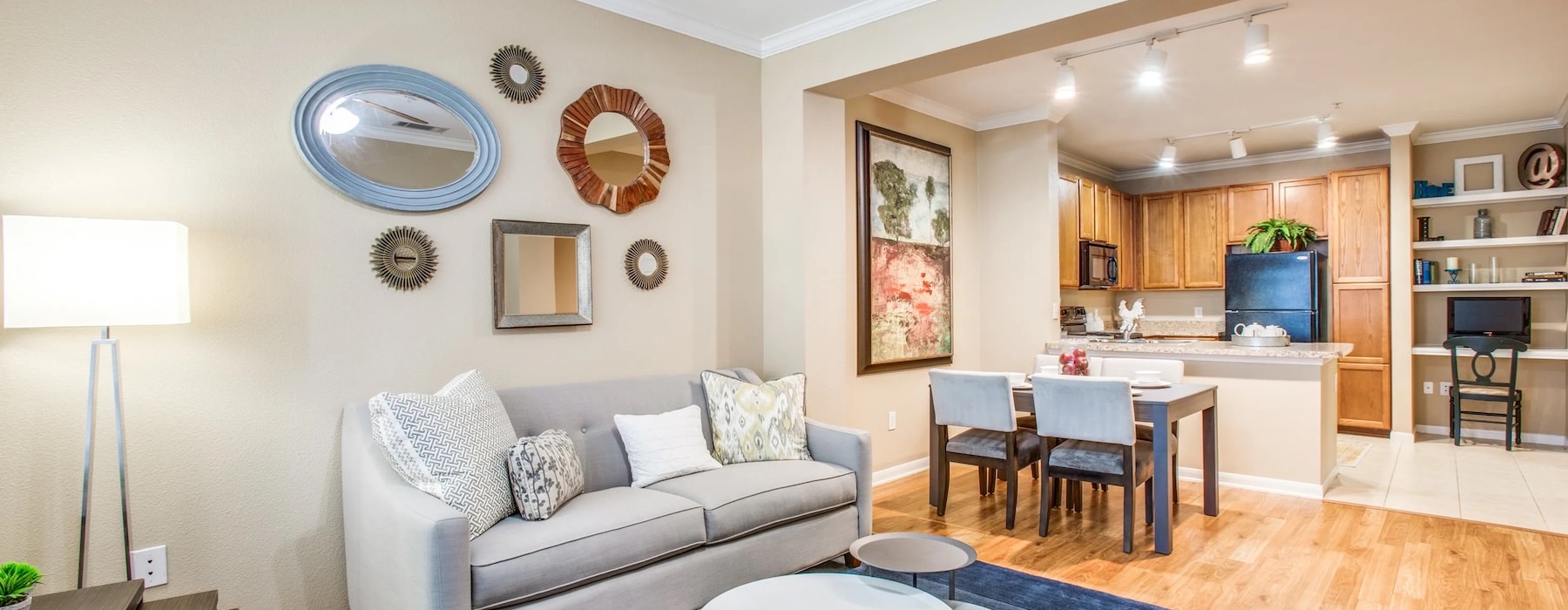 a living room with a couch and a dining table